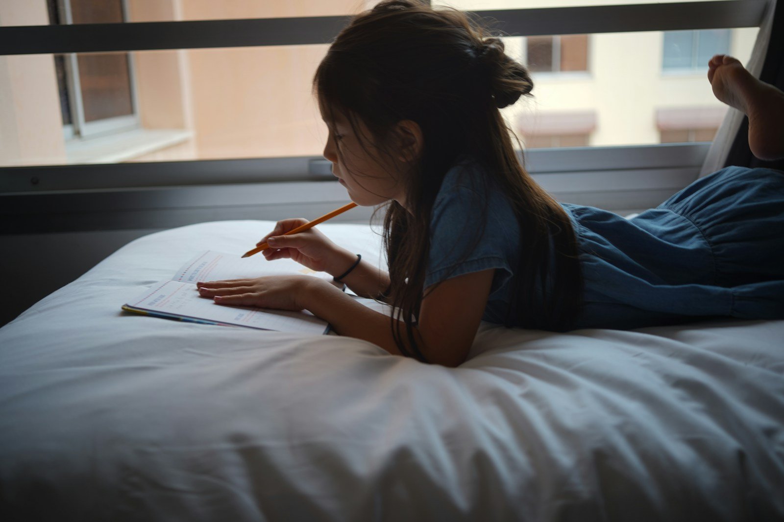 a woman writing on a book