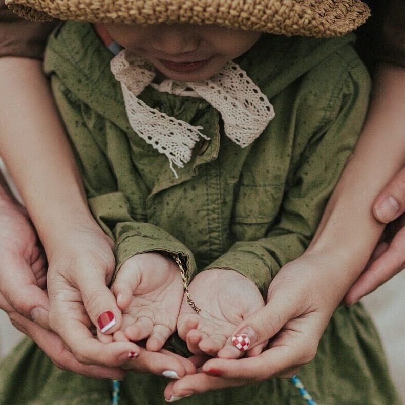 parents child hands family holding hands hugging father mother daughter people love closeup holding hands hugging hugging hugging hugging hugging people